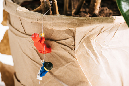 KYIV, UKRAINE - MARCH 15, 2019: close up view of red and blue plastic lego figurines climbing ropeのeditorial素材
