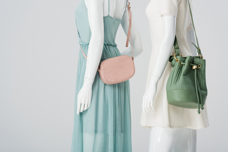 mannequins with bags and dresses isolated on greyの写真素材