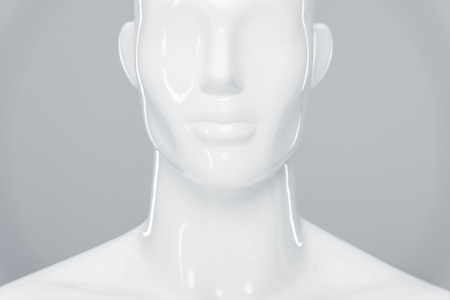 white plastic mannequin figure isolated on greyの写真素材