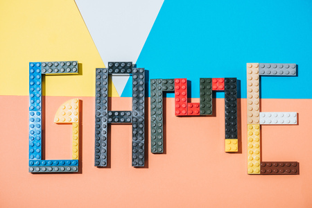 KYIV, UKRAINE - MARCH 15, 2019: top view of word game made of colorful lego blocks on geometrical backgroundのeditorial素材