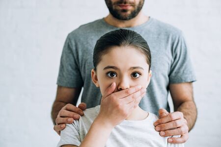 Partial view of father and daughter having conflict at homeの写真素材