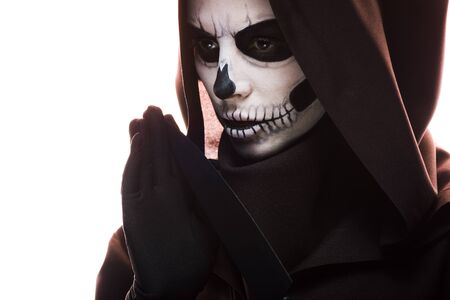 Woman with skull makeup holding knife isolated on white background