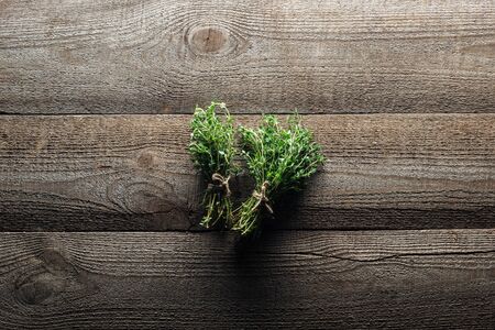 top view of green thyme on wooden weathered tableの写真素材