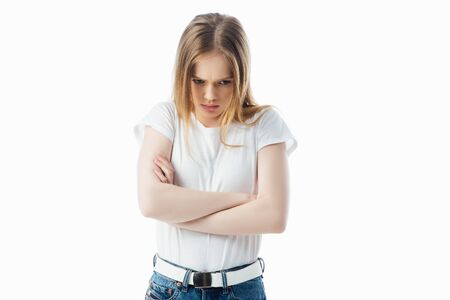 offended teenage girl with crossed arms looking away isolated on white
