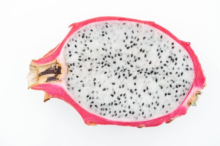 top view of exotic ripe dragon fruit half isolated on whiteの写真素材