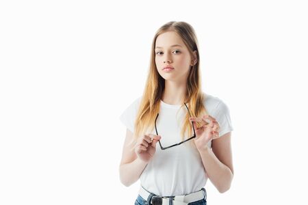 sad teenage girl holding glasses isolated on whiteの写真素材