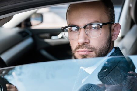 Selective focus of handsome bearded man in glassesの写真素材