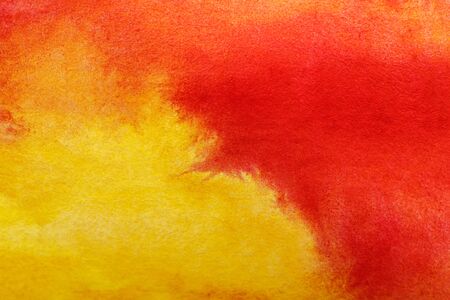 Close up view of yellow and red watercolor mixed paintsの写真素材