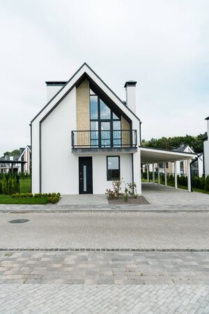 Green grass and plants near new modern and luxury homeの写真素材