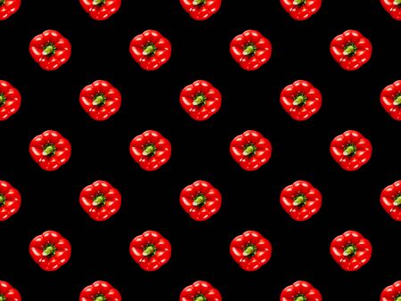 red organic whole bell peppers isolated on black, seamless background patternの写真素材