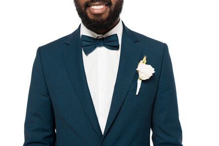 cropped view of cropped view of happy bearded african american bridegroom isolated on whiteの写真素材