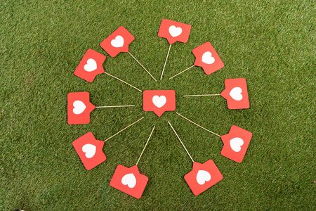 flat lay with social media hearts signs on green fieldの写真素材