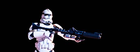 KYIV, UKRAINE - MAY 25, 2019: white imperial stormtrooper with gun isolated on blackのeditorial素材