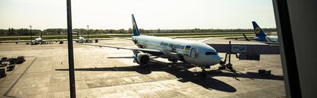 ROME, ITALY - JUNE 28, 2019: panoramic shot of airplanes at aerodrome in sunny day in rome, italy