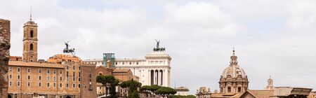 ROME, ITALY - JUNE 28, 2019: panoramic shot of old buildings under cloudy skyのeditorial素材