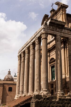 ROME, ITALY - JUNE 28, 2019: temple of Antoninus and Faustina under blue sky