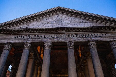 ROME, ITALY - JUNE 28, 2019: ancient pantheon with columns under blue sky