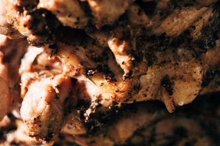 close up view of delicious meat on rotisserieの写真素材