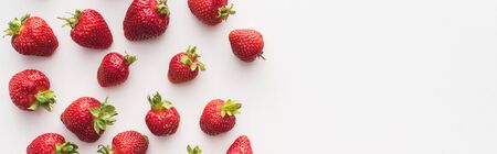 panoramic shot of fresh and ripe strawberries on white background with copy spaceの写真素材