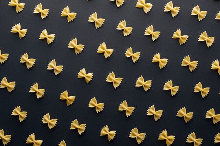 flat lay of farfalle pasta isolated on blackの写真素材