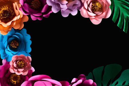top view of paper cut multicolored flowers isolated on black with copy space