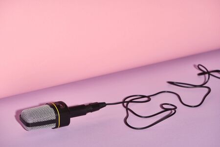 black microphone on bright and colorful background with copy space