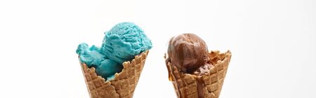 delicious sweet chocolate and blue ice cream in crispy waffle cones isolated on white, panoramic...