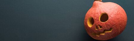 panoramic shot of Halloween pumpkin on black backgroundの写真素材