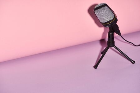 black microphone on bright and colorful background with copy spaceの写真素材