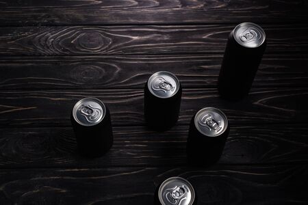aluminum cans of beer on wooden table with copy spaceの写真素材