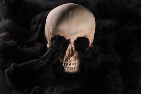spooky human skull with black dark clouds, Halloween decorationの写真素材