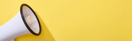 panoramic shot of loudspeaker on bright and colorful background