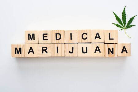 top view of wooden blocks with medical marijuana lettering on white backgroundの写真素材