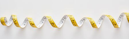 panoramic shot of colorful measuring tape on white backgroundの写真素材