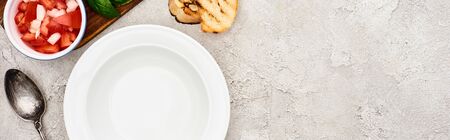 top view of empty plate near wooden cutting board with fresh ingredients, panoramic shot