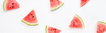 panoramic shot of fresh watermelon slices on white backgroundの写真素材