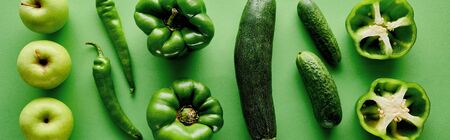 panoramic shot of fresh and green peppers, zucchini, cucumbers and apples