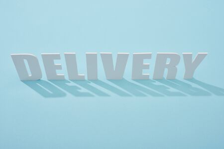 white delivery inscription with shadows on blue background