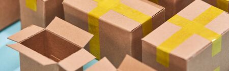 panoramic view of miniature postal boxes with yellow adhesive tape