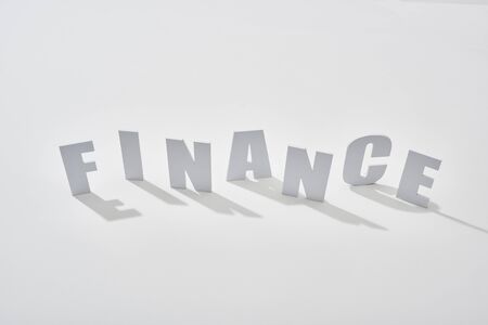 finance lettering with shadows on white backgroundの写真素材