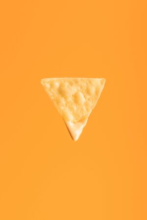 top view of crispy nacho isolated on orange, Mexican cuisineの写真素材