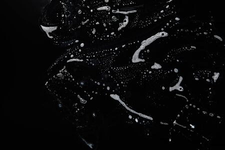 top view of white soap on black background with copy spaceの写真素材