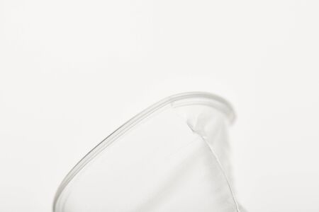 close up view of transparent plastic cup on white backgroundの写真素材