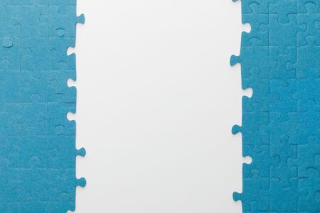 top view of blue jigsaw puzzle on white backgroundの写真素材