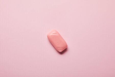 top view of pink soap on pastel background with copy spaceの写真素材