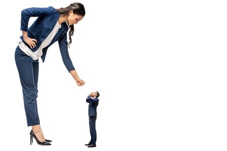 big businesswoman showing clenched fist at small businessman Isolated On White
