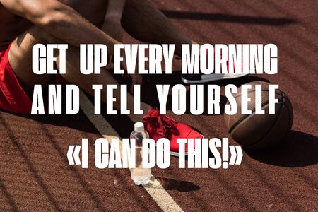 get up every morning and tell yourself I can do this lettering on partial view of sportsman in red...