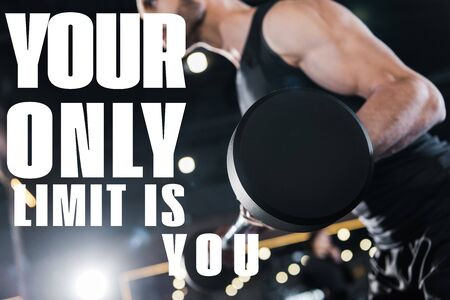 selective focus of strong man exercising with heavy barbell in gym with your only limit is you...