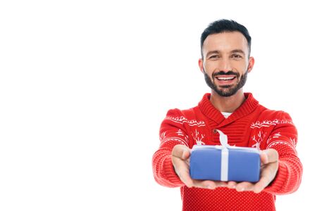selective focus of happy bearded man holding present isolated on white