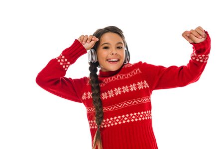 happy kid in headphones gesturing isolated on whiteの写真素材